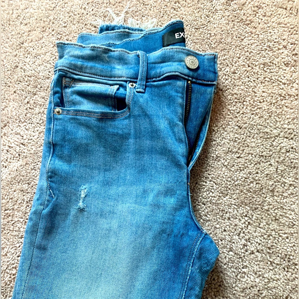 Express Mid Rise Light Wash Raw Hem Skinny Jeans